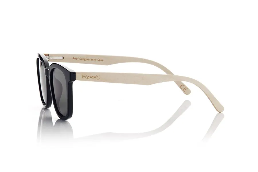 Wood eyewear of Maple MALM. MALM sunglasses are an ideal option for those looking for a modern and daring design with a touch of originality. Its completely straight and flat frame in satin black gives it a modern and elegant look. With rounded shapes and a marked brow, these glasses are suitable for both men and women. The very light maple wood temples add an interesting contrast and a natural touch to the design. In addition, these glasses are available with clear flat lenses in various colors, such as yellow, blue, pink and khaki green, allowing you to customize your look and adapt it to your personal style. Without a doubt, MALM sunglasses are a perfect choice for those looking for a combination of modern design and marked style. for Wholesale & Retail | Root Sunglasses® 